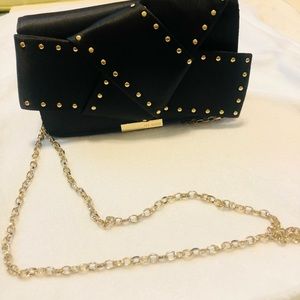 Ted Baker Bow clutch with gold studs on bow/ chain